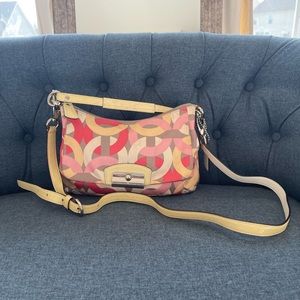 New, never used. Mini Cross body spring edition coach bag. Perfect for spring